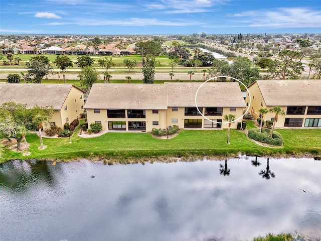 bird's eye view with a water view and a residential view