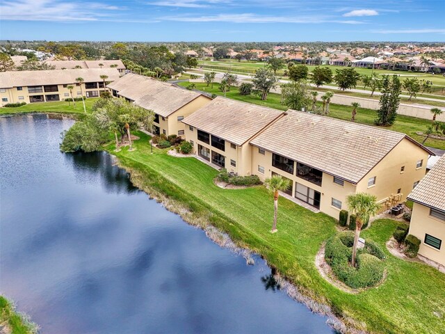 birds eye view of property with a water view and a residential view