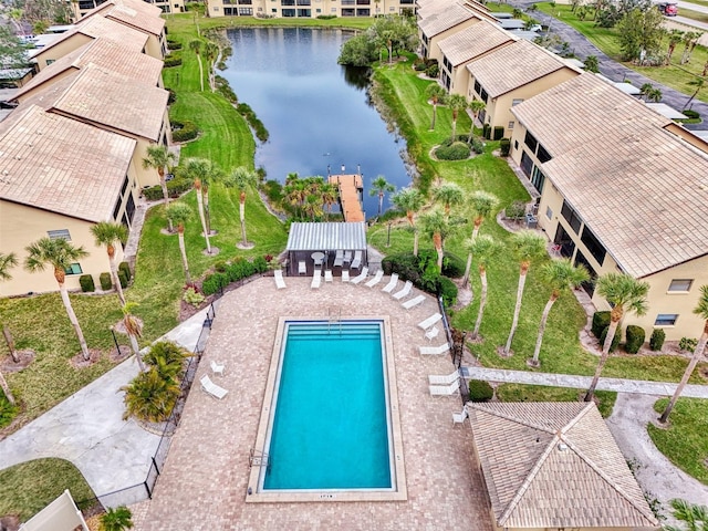 view of swimming pool with a water view