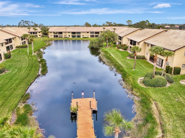 bird's eye view with a water view and a residential view