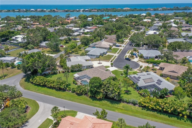 aerial view with a water view and a residential view