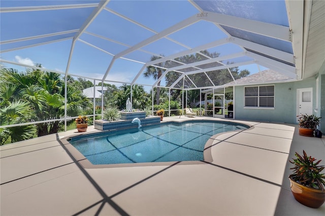 outdoor pool with glass enclosure and a patio