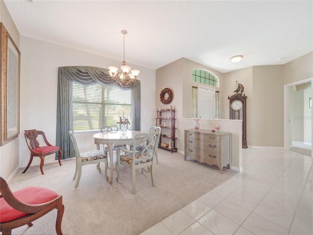 dining space featuring light carpet, an inviting chandelier, light tile patterned floors, and baseboards