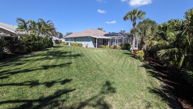 view of yard featuring a lanai