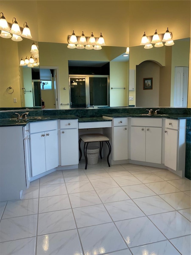 full bathroom featuring a shower stall and vanity