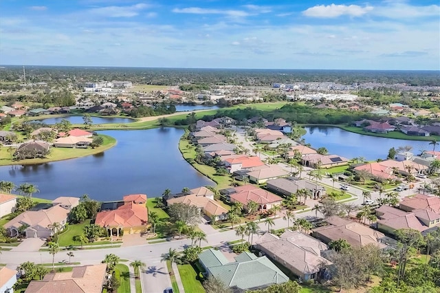 bird's eye view with a residential view and a water view