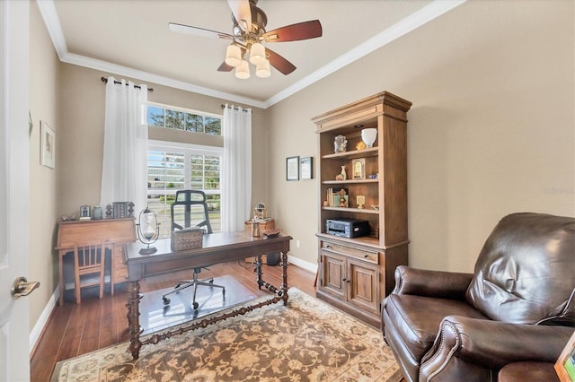 office area featuring ceiling fan, crown molding, baseboards, and wood finished floors