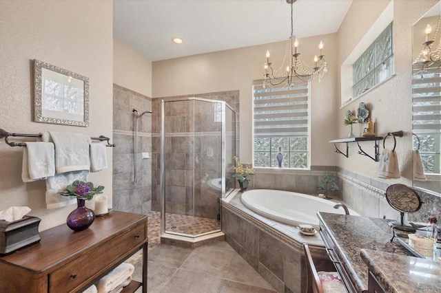 bathroom featuring a garden tub, tile patterned flooring, a shower stall, and a notable chandelier