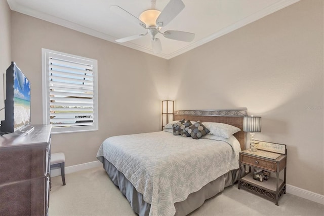 bedroom with crown molding, ceiling fan, baseboards, and light colored carpet