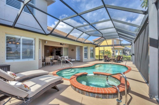 view of pool featuring a lanai, a patio area, a pool with connected hot tub, and outdoor dining space