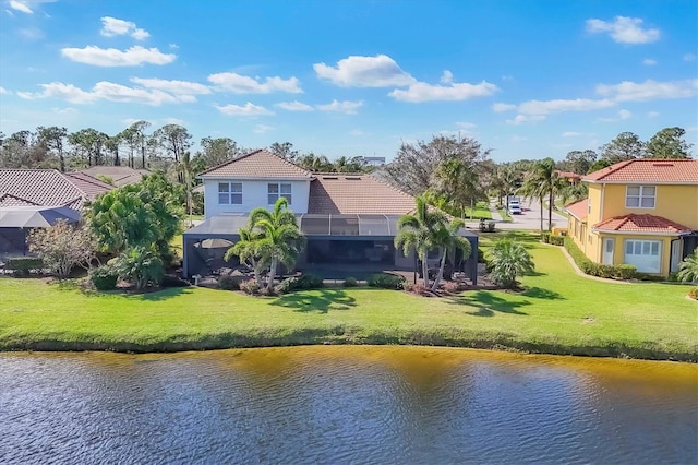 drone / aerial view with a water view and a residential view