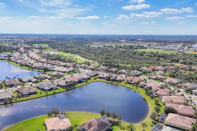 drone / aerial view featuring a water view and a residential view