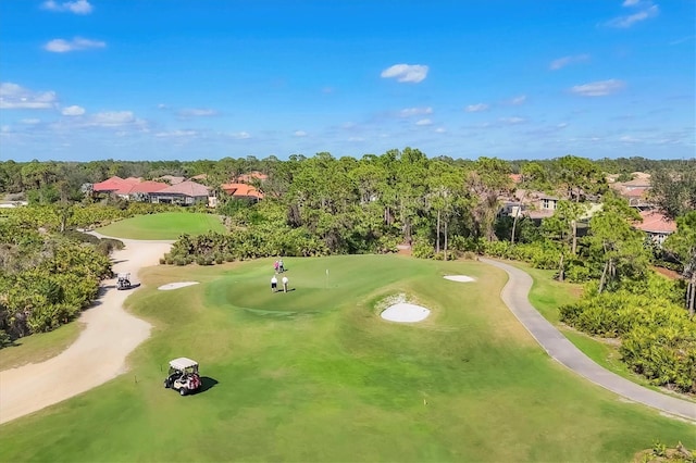 bird's eye view featuring view of golf course and a residential view