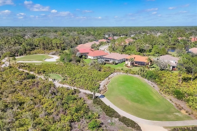 bird's eye view featuring golf course view and a view of trees