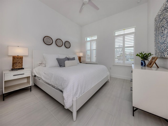 bedroom featuring ceiling fan and baseboards