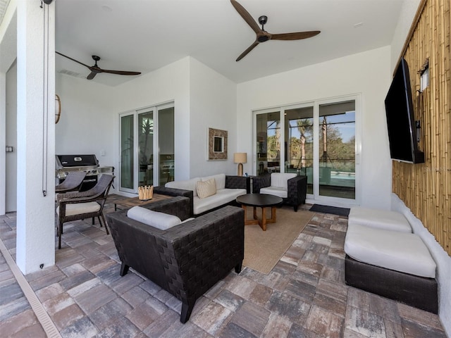 view of patio featuring outdoor lounge area and a ceiling fan