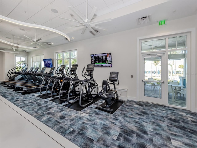 workout area with carpet, baseboards, and ceiling fan