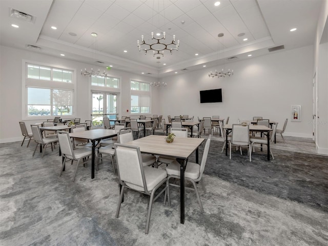 dining area featuring visible vents, french doors, a tray ceiling, and carpet flooring