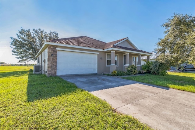 single story home featuring concrete driveway, an attached garage, a tiled roof, and a front yard