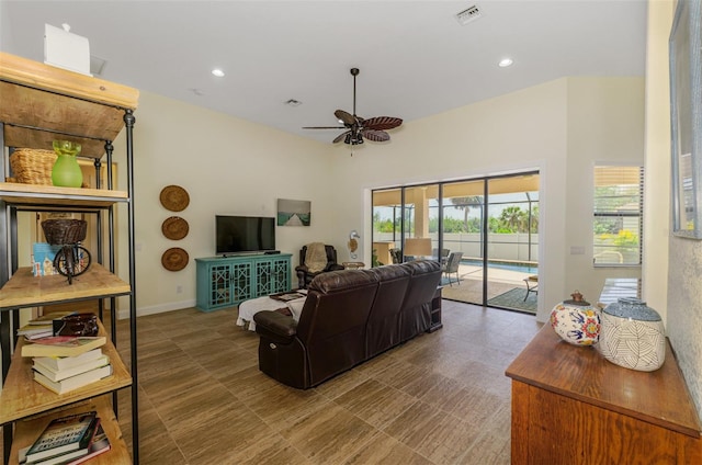 living room featuring baseboards, recessed lighting, visible vents, and a ceiling fan