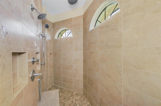 full bath featuring a tile shower