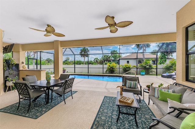 view of pool with a lanai, outdoor lounge area, a fenced in pool, outdoor dining space, and a patio area