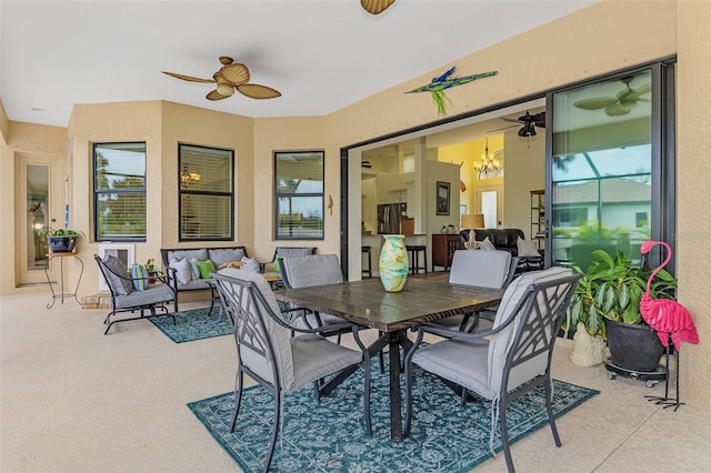 view of patio / terrace featuring outdoor dining area, ceiling fan, and an outdoor hangout area