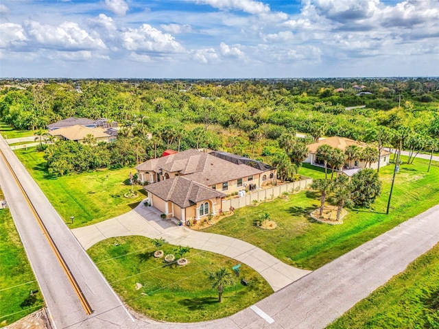 drone / aerial view featuring a view of trees