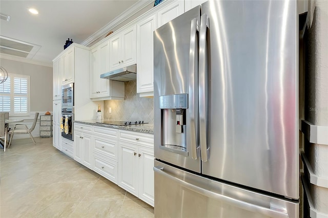 kitchen featuring white cabinets, under cabinet range hood, stainless steel appliances, and decorative backsplash