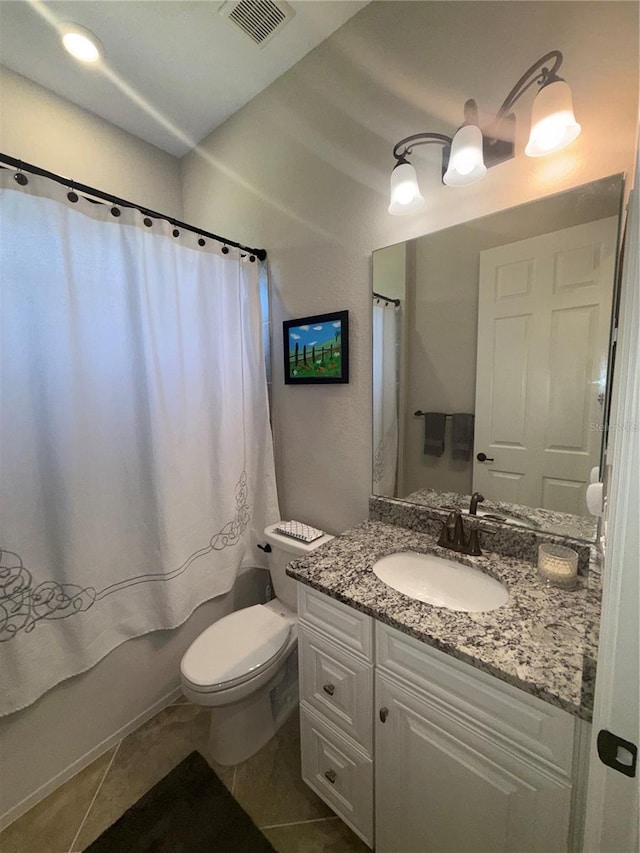 bathroom featuring visible vents, toilet, shower / bath combo, vanity, and tile patterned flooring