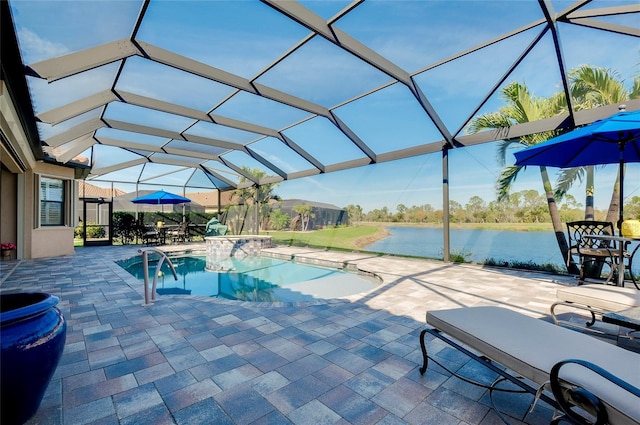 pool with glass enclosure, a patio area, a water view, and a jacuzzi