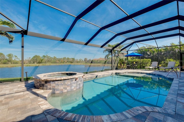 view of pool featuring a patio, a water view, a lanai, and a pool with connected hot tub