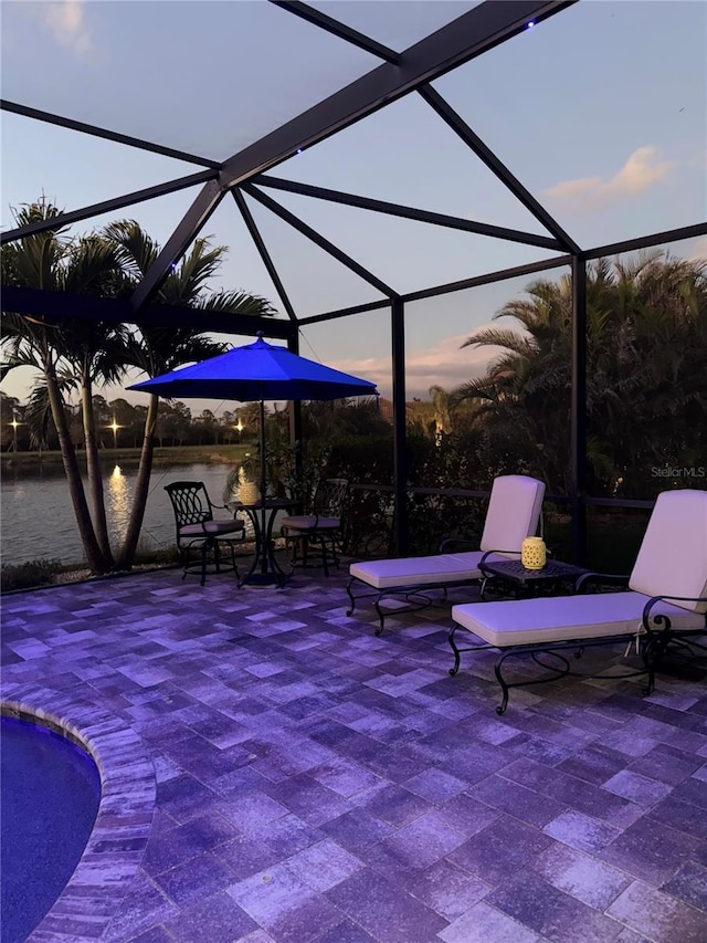 patio terrace at dusk with glass enclosure