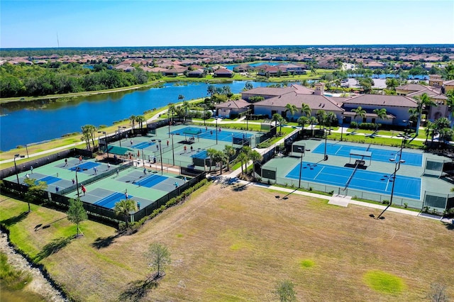 drone / aerial view featuring a water view and a residential view