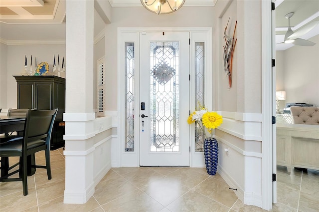 entrance foyer featuring light tile patterned floors and ornamental molding