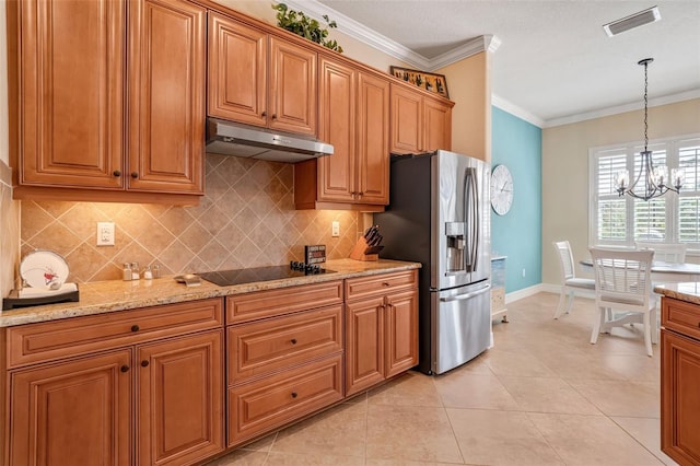 kitchen featuring visible vents, stainless steel fridge with ice dispenser, black electric cooktop, crown molding, and under cabinet range hood