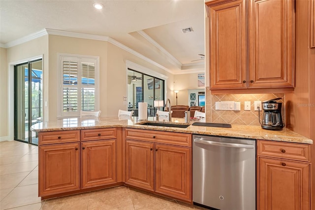 kitchen with light stone counters, visible vents, a sink, and stainless steel dishwasher