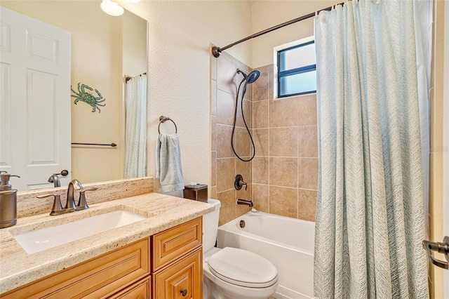 bathroom featuring shower / tub combo, vanity, and toilet