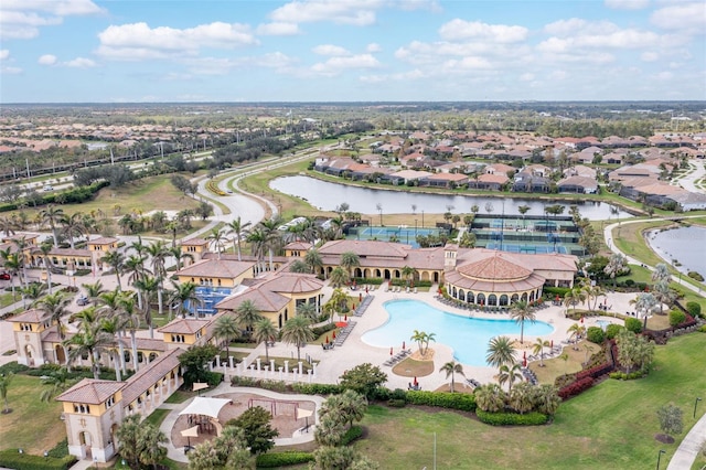 drone / aerial view with a residential view and a water view