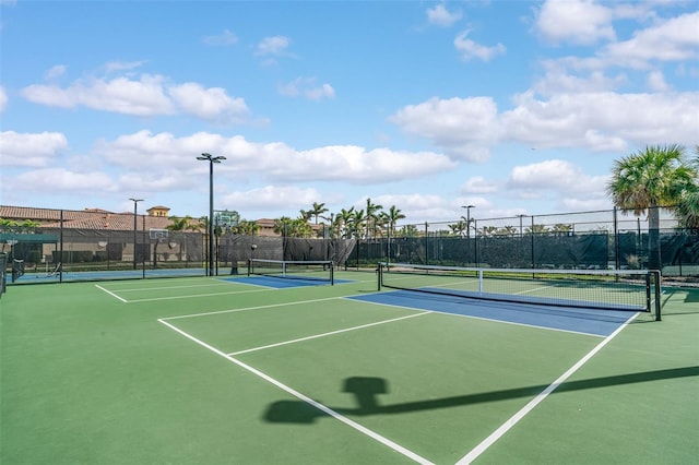 view of sport court with fence