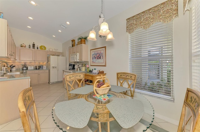 dining area with visible vents, recessed lighting, an inviting chandelier, light tile patterned floors, and lofted ceiling