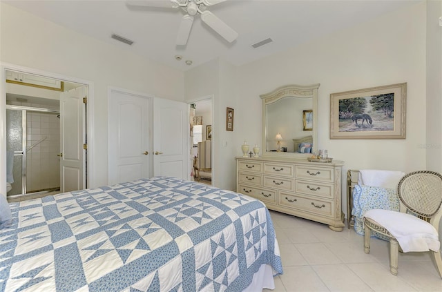 bedroom featuring light tile patterned floors, visible vents, and a ceiling fan