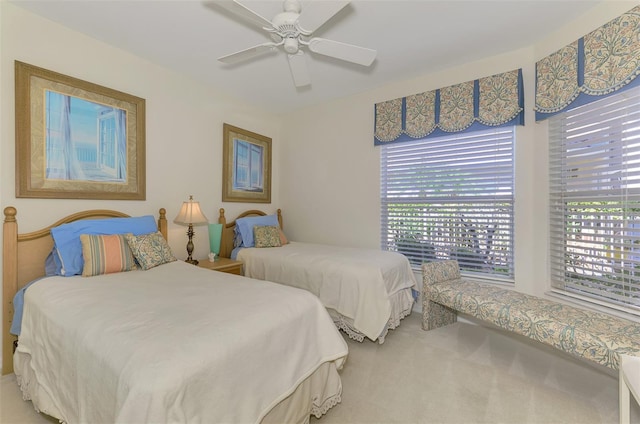 bedroom with carpet and a ceiling fan