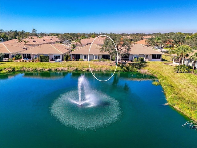 birds eye view of property featuring a residential view and a water view