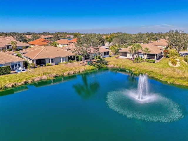 aerial view with a residential view and a water view