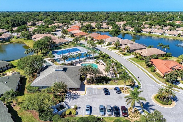 birds eye view of property with a residential view and a water view