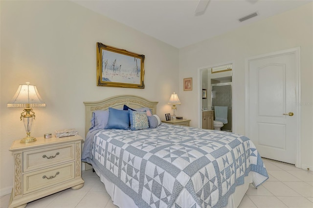 bedroom featuring light tile patterned floors, visible vents, and connected bathroom