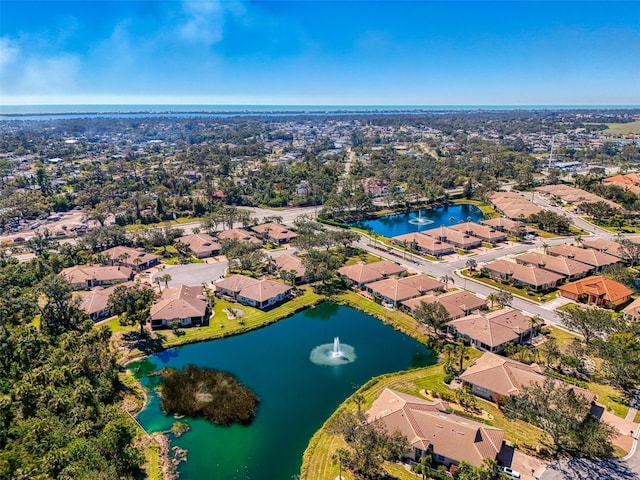 bird's eye view featuring a residential view and a water view