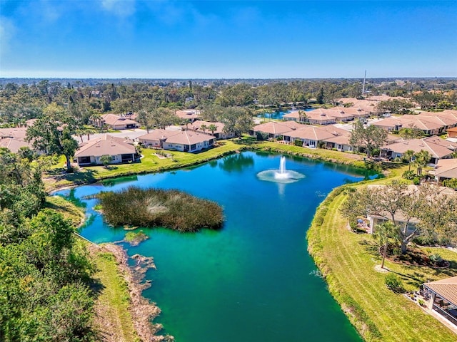 bird's eye view featuring a residential view and a water view