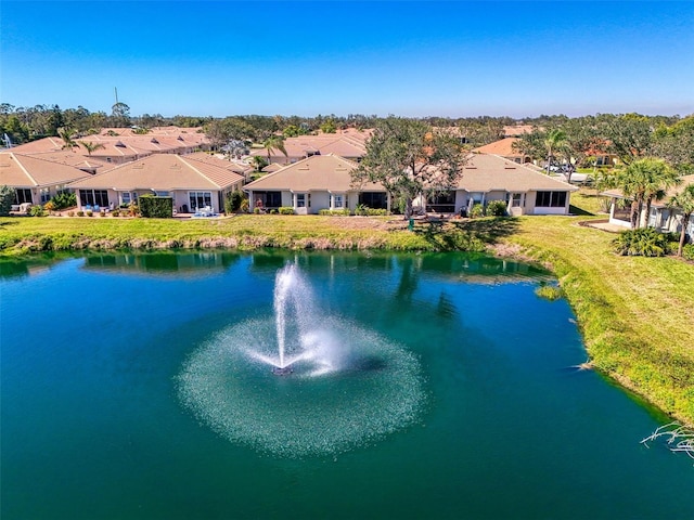 bird's eye view featuring a residential view and a water view